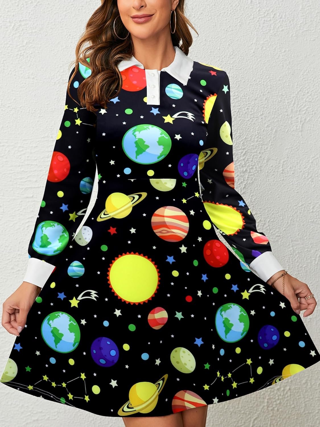 A woman in a dress with a colorful space-themed auto-draft pattern.