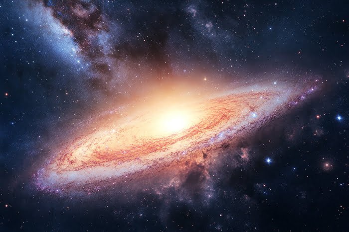 A detailed image of a spiral galaxy with a bright, glowing center and swirling arms, set against a dark, star-filled background. This galaxy's intricate structure captivates with its celestial beauty.