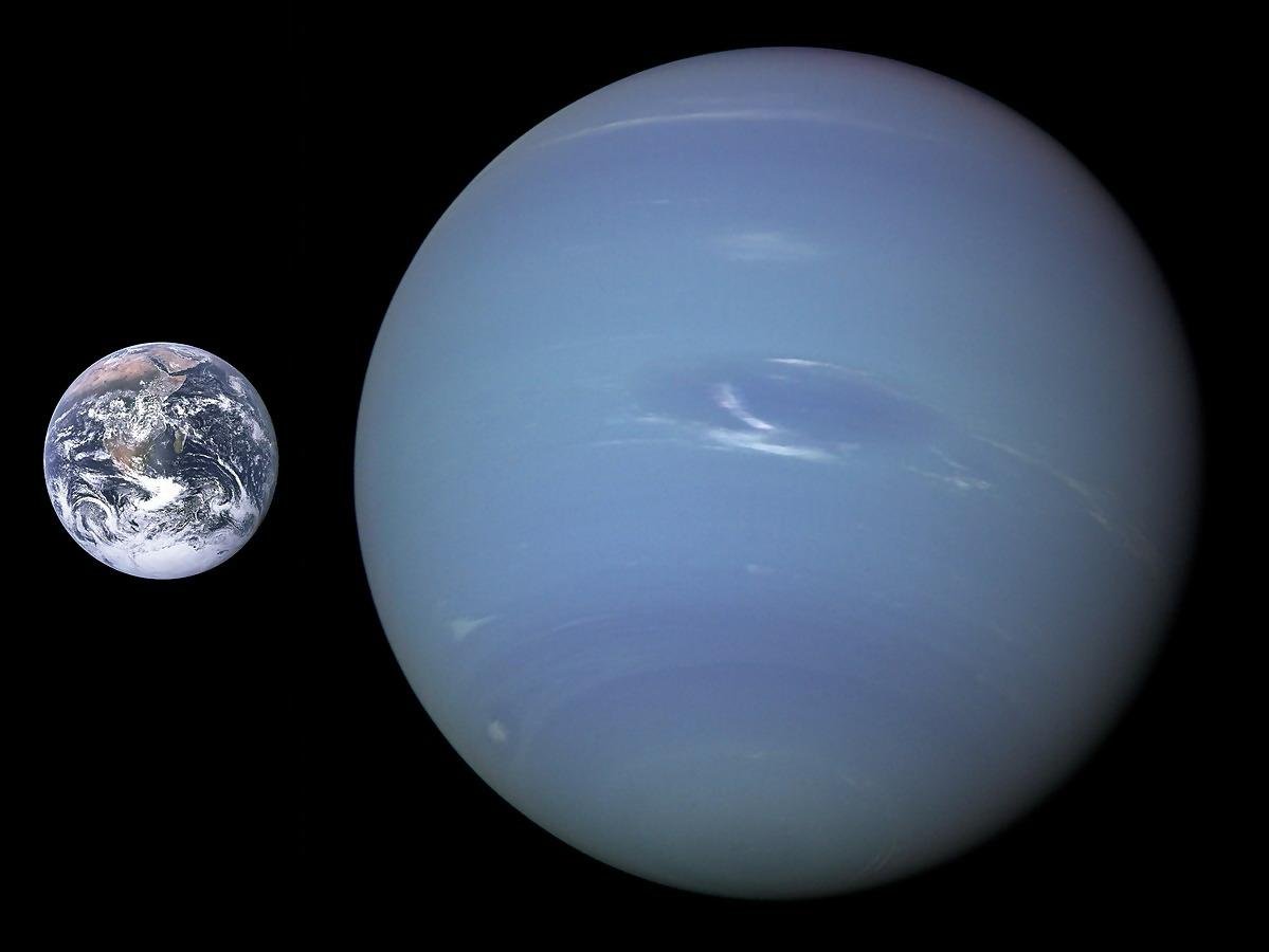 A side-by-side comparison of Earth and Neptune beautifully illustrates the stark size difference, showcasing Neptune's massive scale.