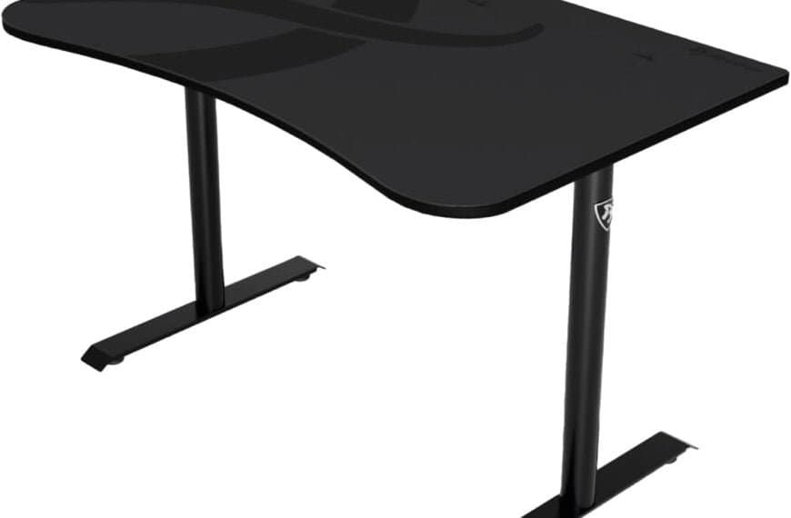A black, minimalist desk with a curved edge and dual metal legs.