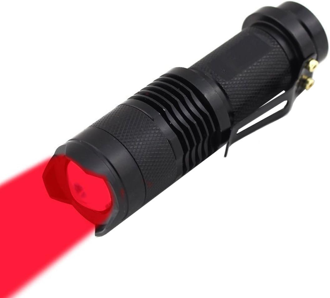 A black flashlight with a textured grip emitting a red beam of light.
