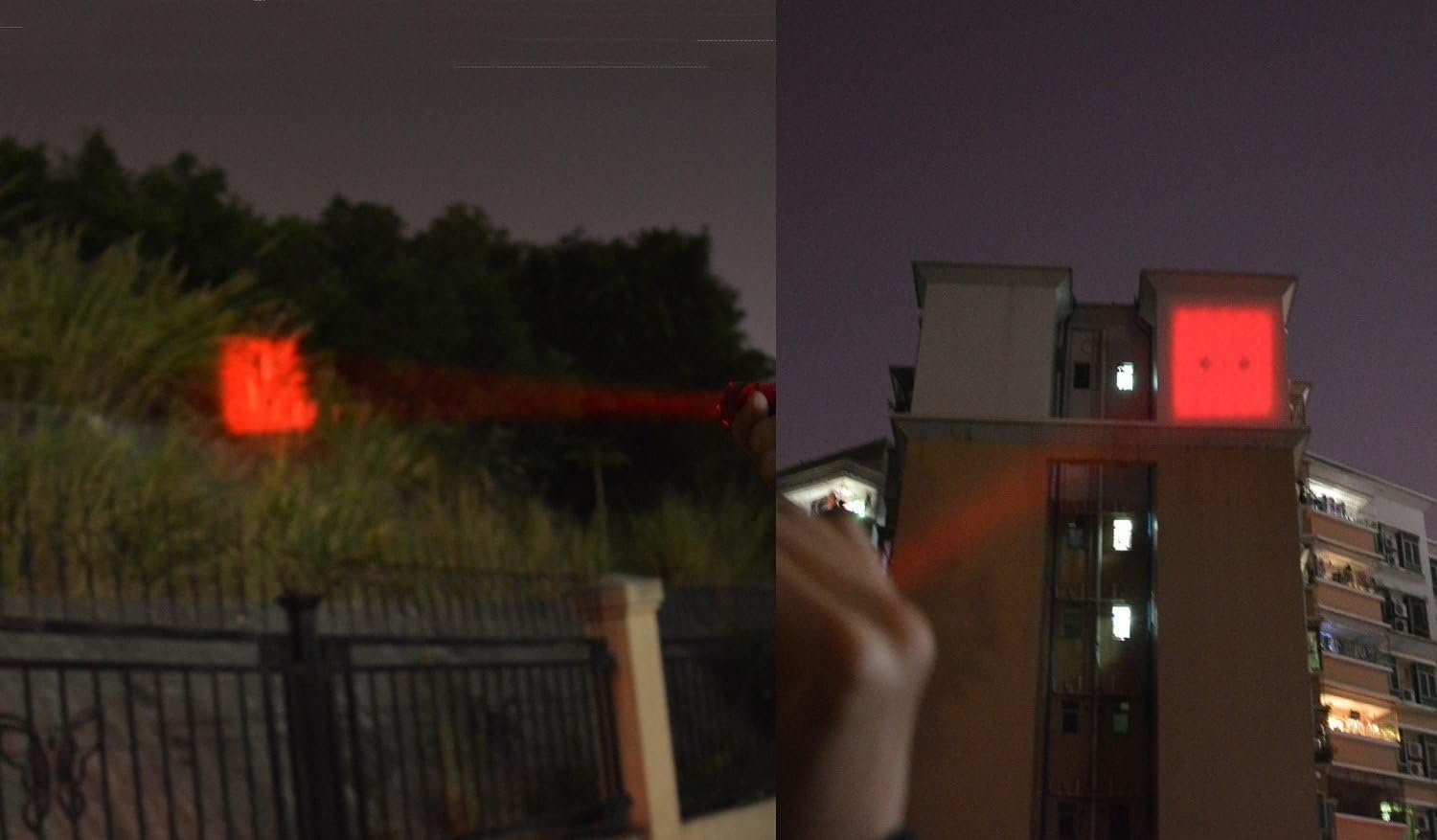 A person points a laser pointer at a building and a bush at night, creating red dot projections on both surfaces.