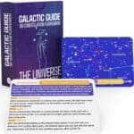 A box of Galactic Guide flashcards titled "88 Constellation Flashcards" with a few cards displayed, including one about the Andromeda constellation with facts and a star map.