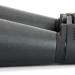 A pair of black binoculars with large lenses, ribbed grip on the body, and an adjustable central focusing mechanism.