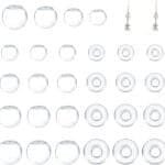 A grid of clear, round glass beads of varying sizes and two beaded earrings with pearls and golden accents.