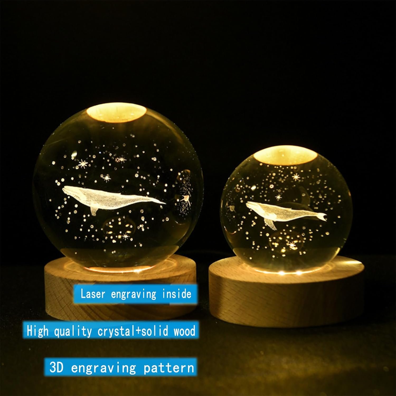 Two crystal spheres on wooden bases with 3D laser engravings of whales and stars. Labels highlight "laser engraving inside," "high quality crystal+solid wood," and "3D engraving pattern.