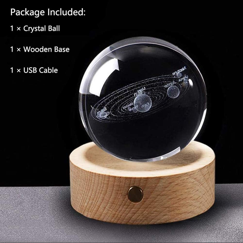 Crystal ball with solar system design on a wooden base, includes a USB cable.