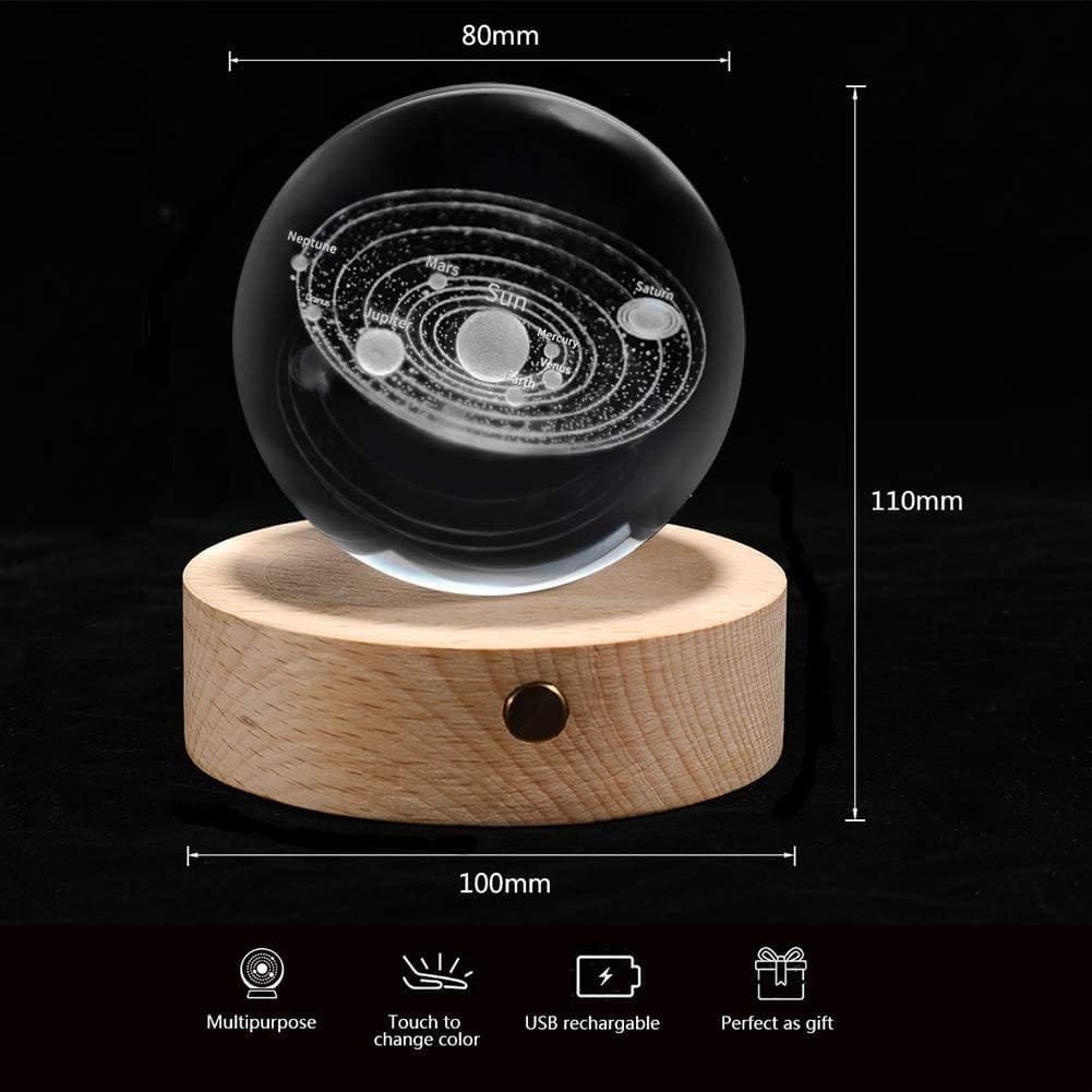 A crystal sphere with a solar system design, placed on a wooden base. Measurements indicate the sphere is 80mm in diameter and 110mm in height, while the base is 100mm in diameter.