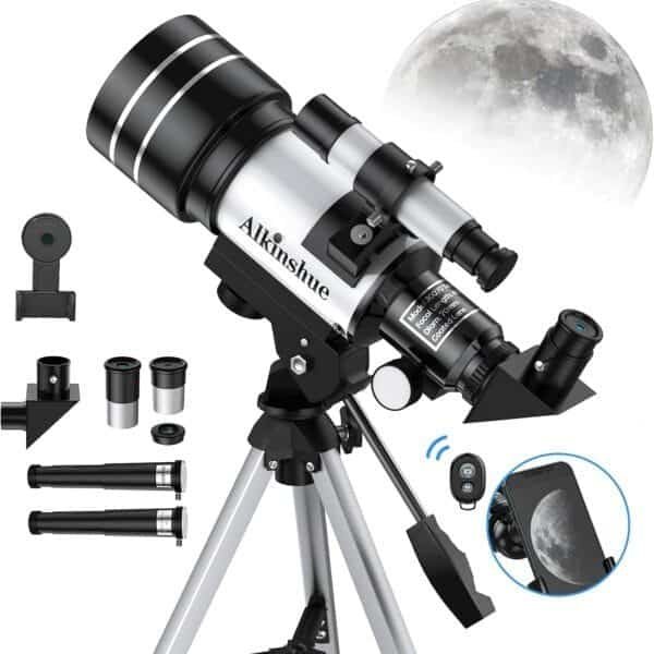 A telescope set with various lenses, a phone mount, and a remote control is displayed. The moon is visible in the background.
