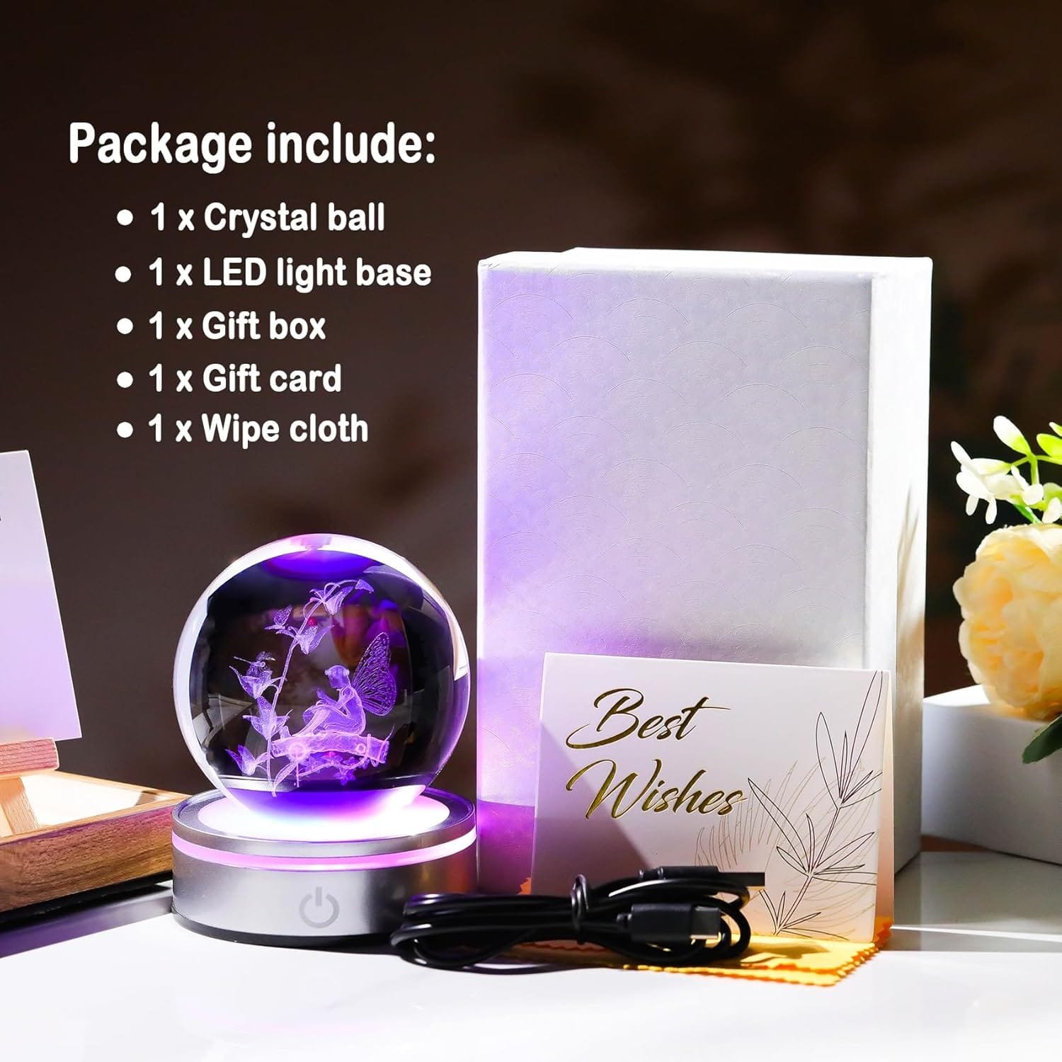 Crystal ball on LED base with purple light, accompanied by a gift box, card, and wipe cloth. A "Best Wishes" card is in the foreground.
