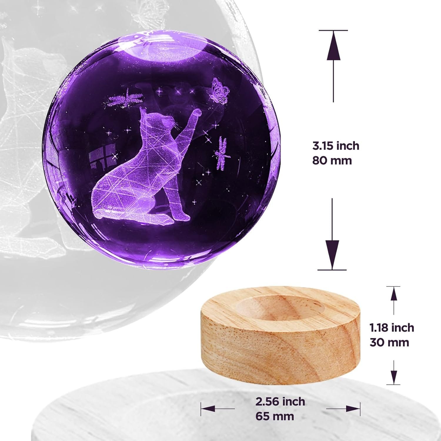 A purple crystal ball displays a cat reaching for a butterfly with dimensions of 3.15 inches in diameter. It rests on a wooden base measuring 2.56 inches wide and 1.18 inches high.