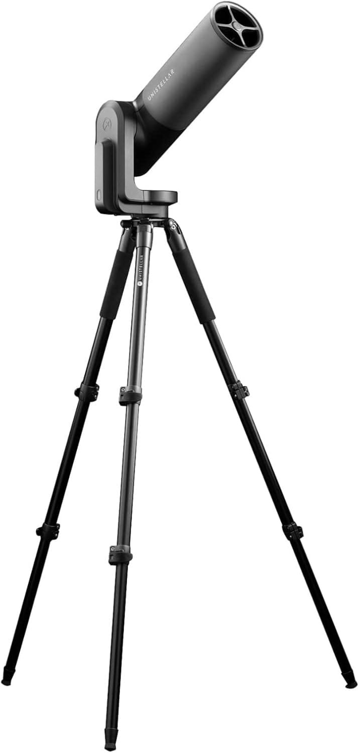 A black telescope mounted on a tripod stand against a white background.