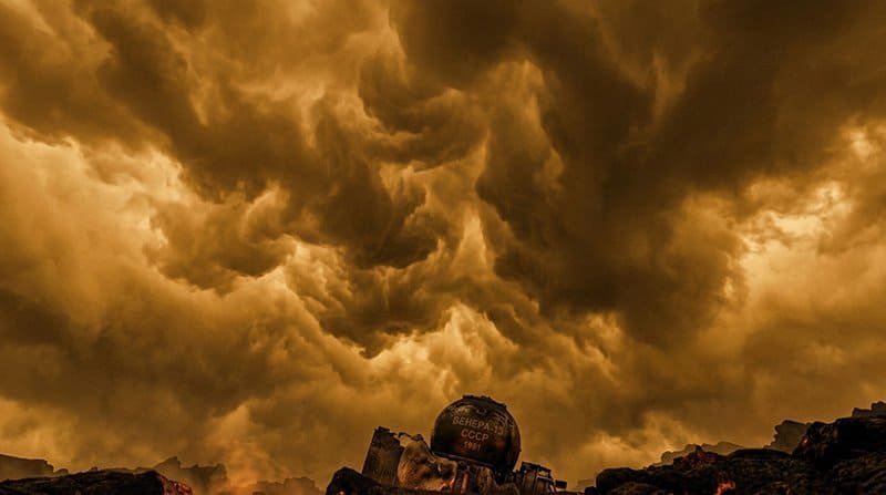 Dark, dramatic clouds fill the sky over a desolate Venus-like landscape with a rusted, partially buried spherical tank marked with Cyrillic writing.