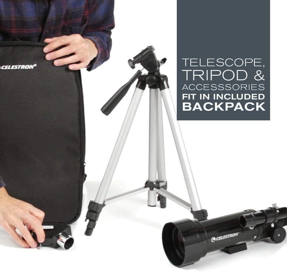 Person assembling a telescope with tripod and accessories, next to a backpack.