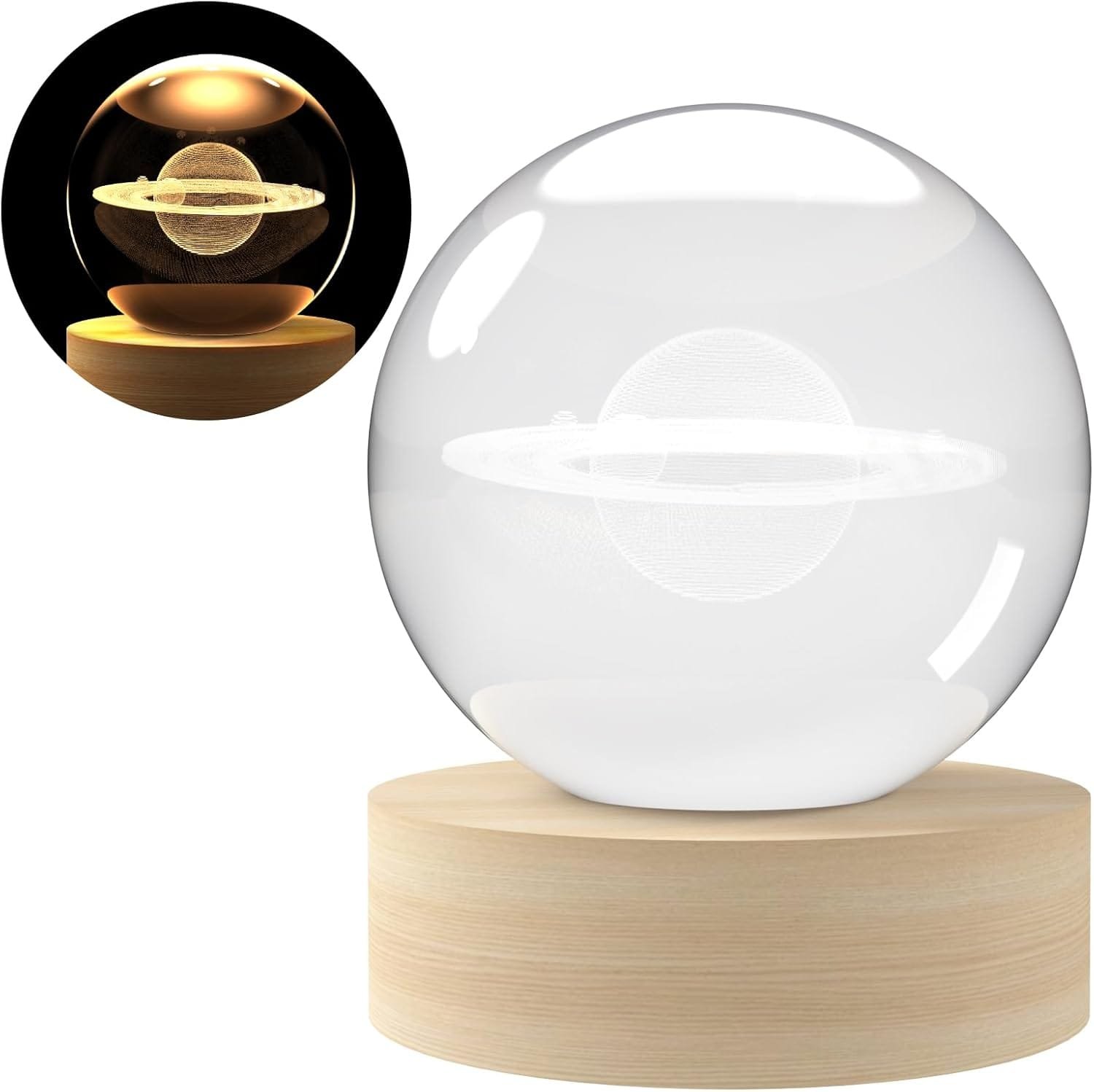 A clear glass ball with an etched Saturn design sits on a wooden base, featuring a light that illuminates the design. An inset shows the ball lit in a dark setting.