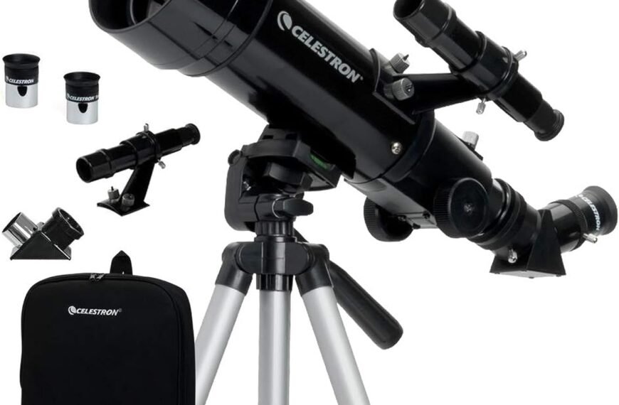 A black Celestron telescope on a tripod with attached finderscope and two eyepieces, and an accessory bag.
