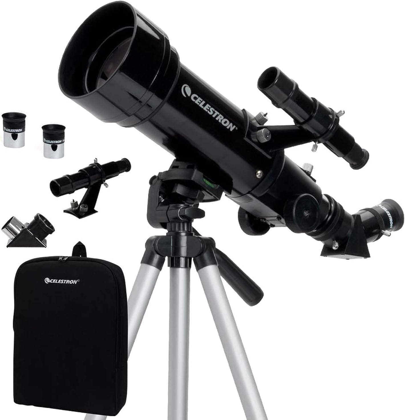 A black Celestron telescope on a tripod with attached finderscope and two eyepieces, and an accessory bag.