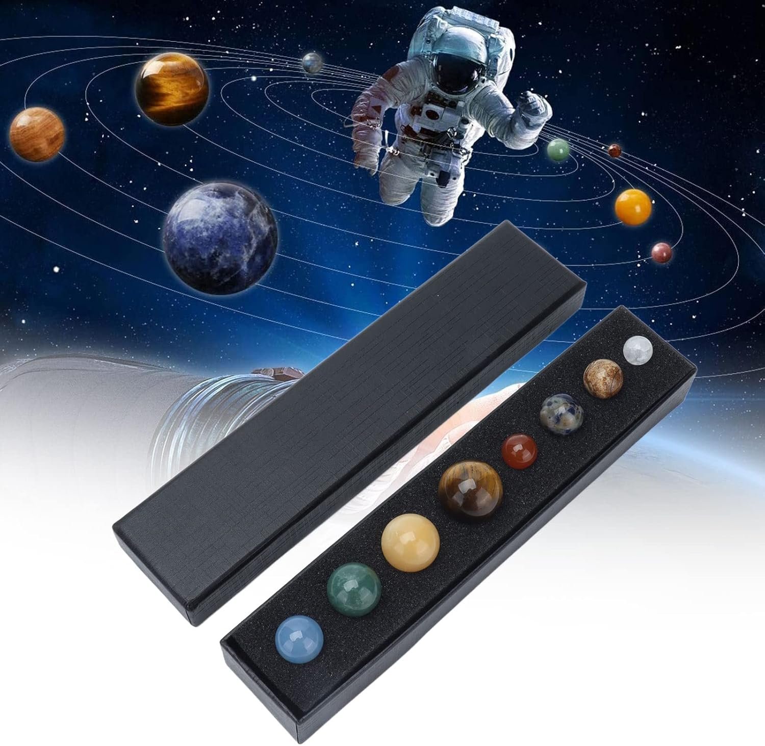 A set of planet-themed marbles in a black box with an astronaut and space backdrop showing planets in orbit.