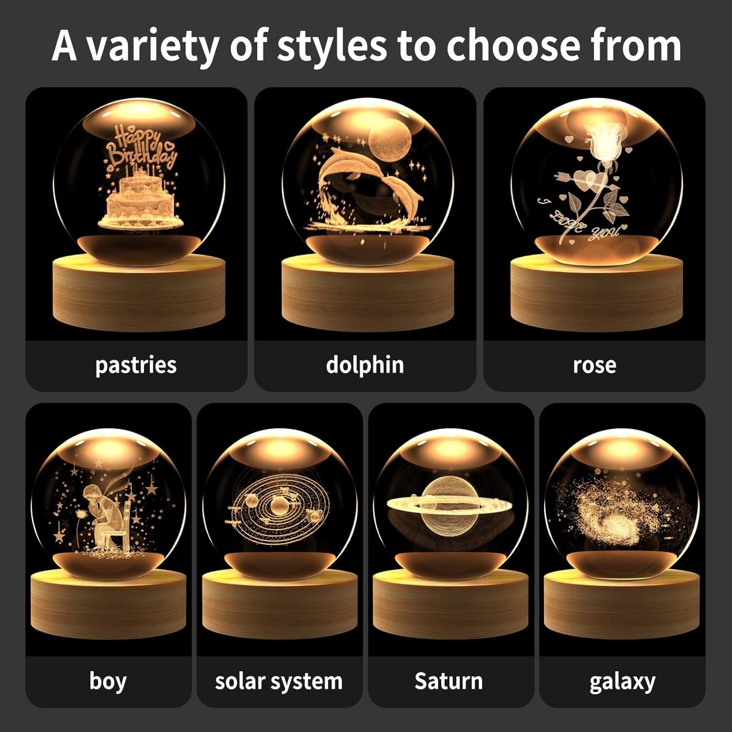 A collection of six glass spheres on wooden bases, featuring designs of pastries, a dolphin, a rose, a boy, the solar system, Saturn, and a galaxy.