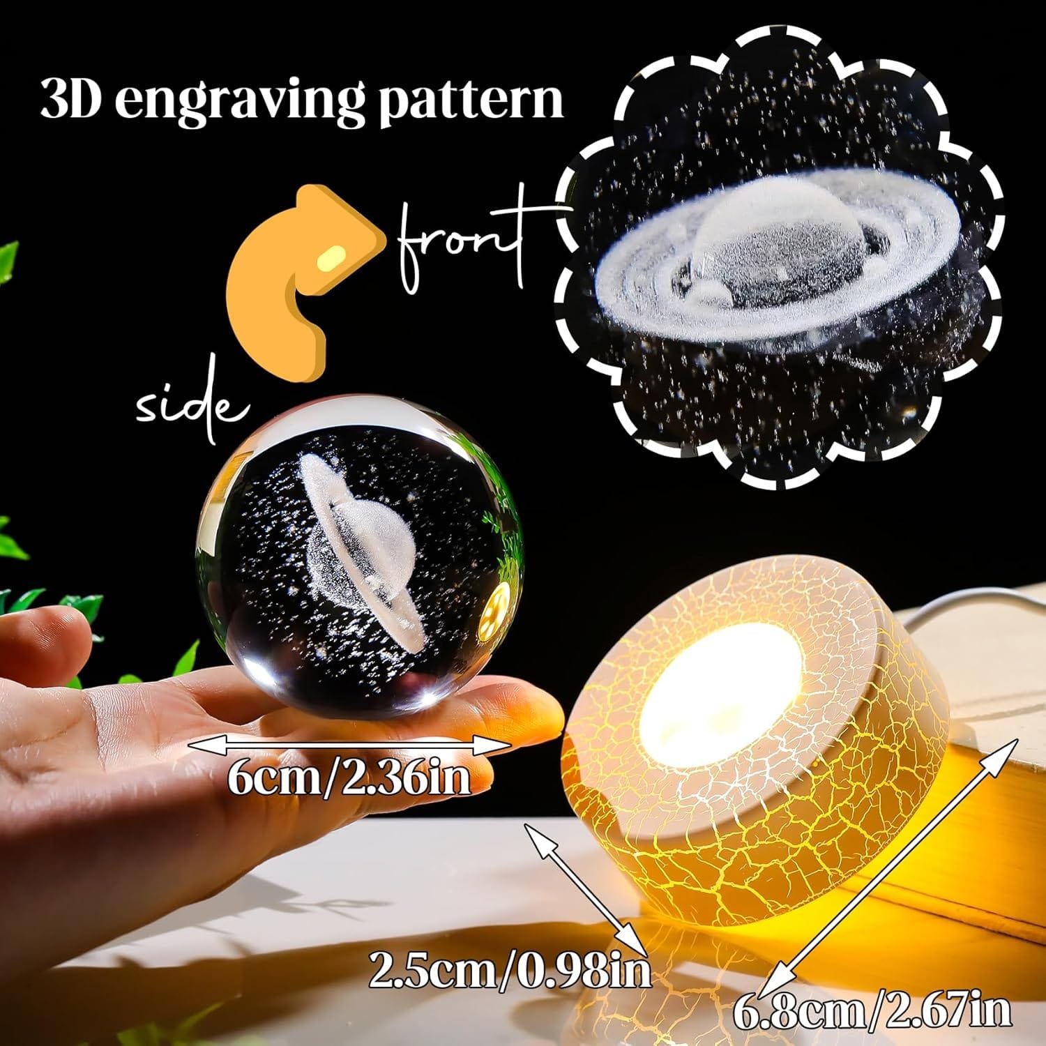 A glass sphere with a 3D engraved Saturn pattern is held above a lighted base with a cracked texture. The dimensions of the sphere and base are shown in both centimeters and inches.