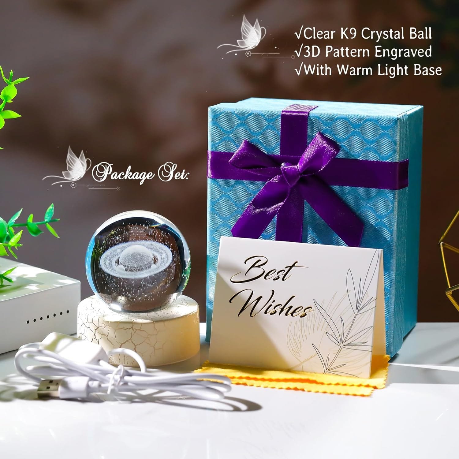 Gift set with a clear K9 crystal ball on a lighted base, a blue gift box with a purple ribbon, a "Best Wishes" card, a cloth, and a USB cable.