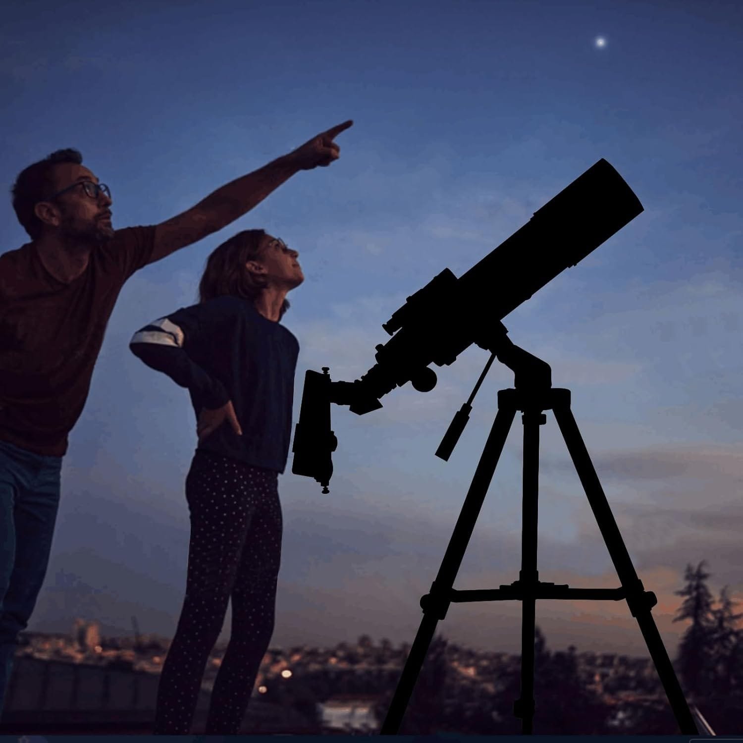 A man and a child observe the night sky, with the man pointing at a star. A telescope is silhouetted in the foreground.