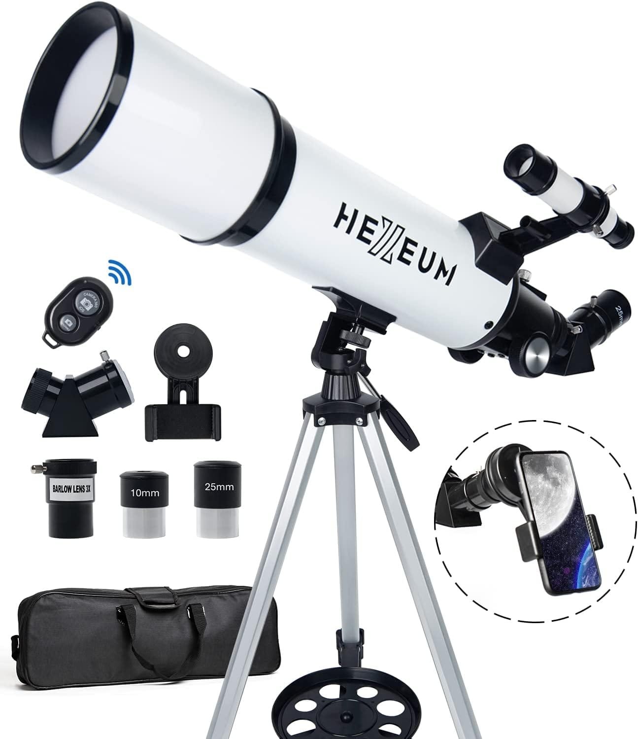 White and black telescope with tripod, smartphone adapter, lens caps, and carrying bag. Includes 25mm and 10mm eyepieces and an adapter for photography.