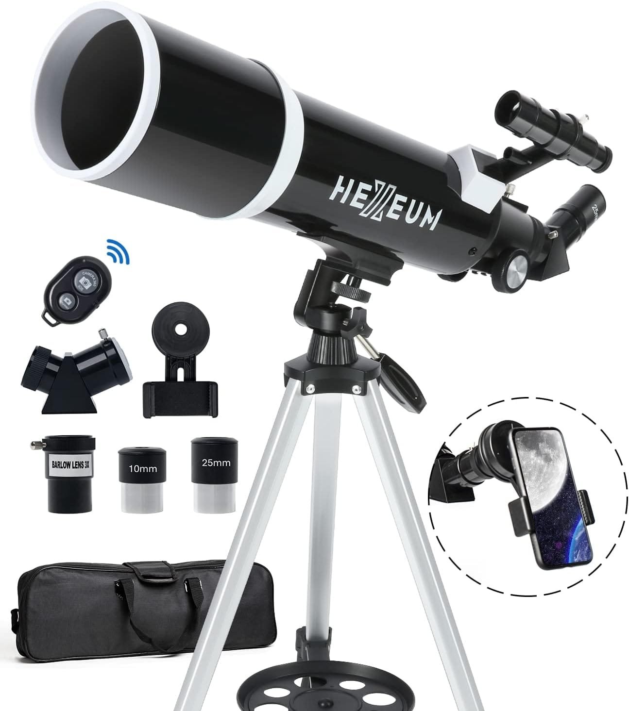 A black telescope on a tripod is surrounded by various accessories, including lenses, a smartphone holder, and a carrying bag.