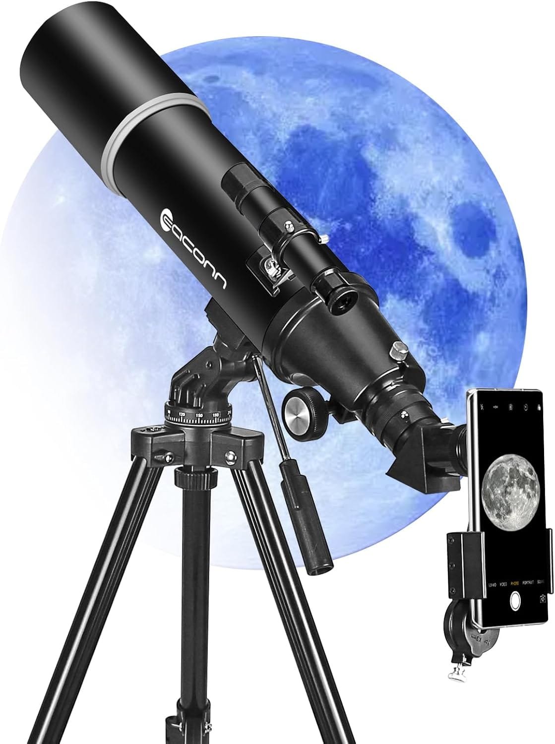 A black telescope on a tripod with a smartphone attached, capturing a detailed image of the moon. A large moon is visible in the background.