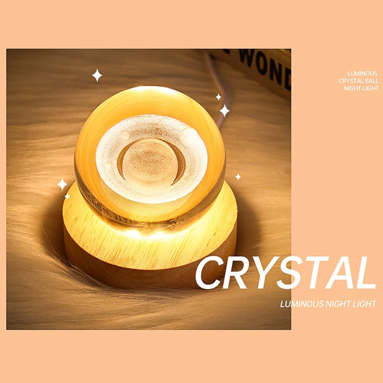 A glowing crystal ball night light on a wooden base with sparkles around it, set against a peach background. Text reads "CRYSTAL LUMINOUS NIGHT LIGHT.