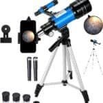 A blue and black telescope on a tripod with smartphone holder and multiple eyepieces displayed. Image of a planet is shown magnified through the telescope.