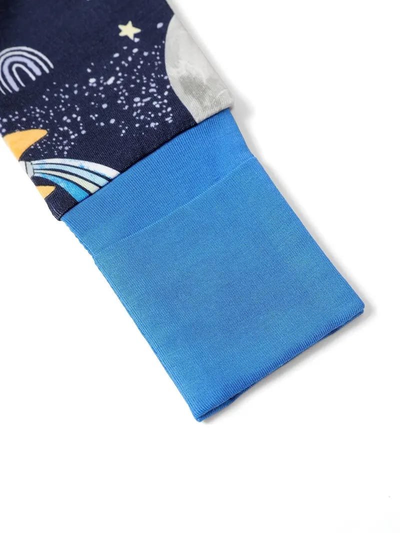 Close-up of a blue sleeve with a space-themed fabric design, featuring stars, planets, and rainbows.