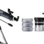 A Celestron refractor telescope with a tripod is shown alongside multiple eyepieces, a Barlow lens, and other accessories arranged neatly on a white background.