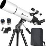 A white telescope with a tripod stand, accompanied by two eyepieces, a diagonal mirror, and a black carrying bag.