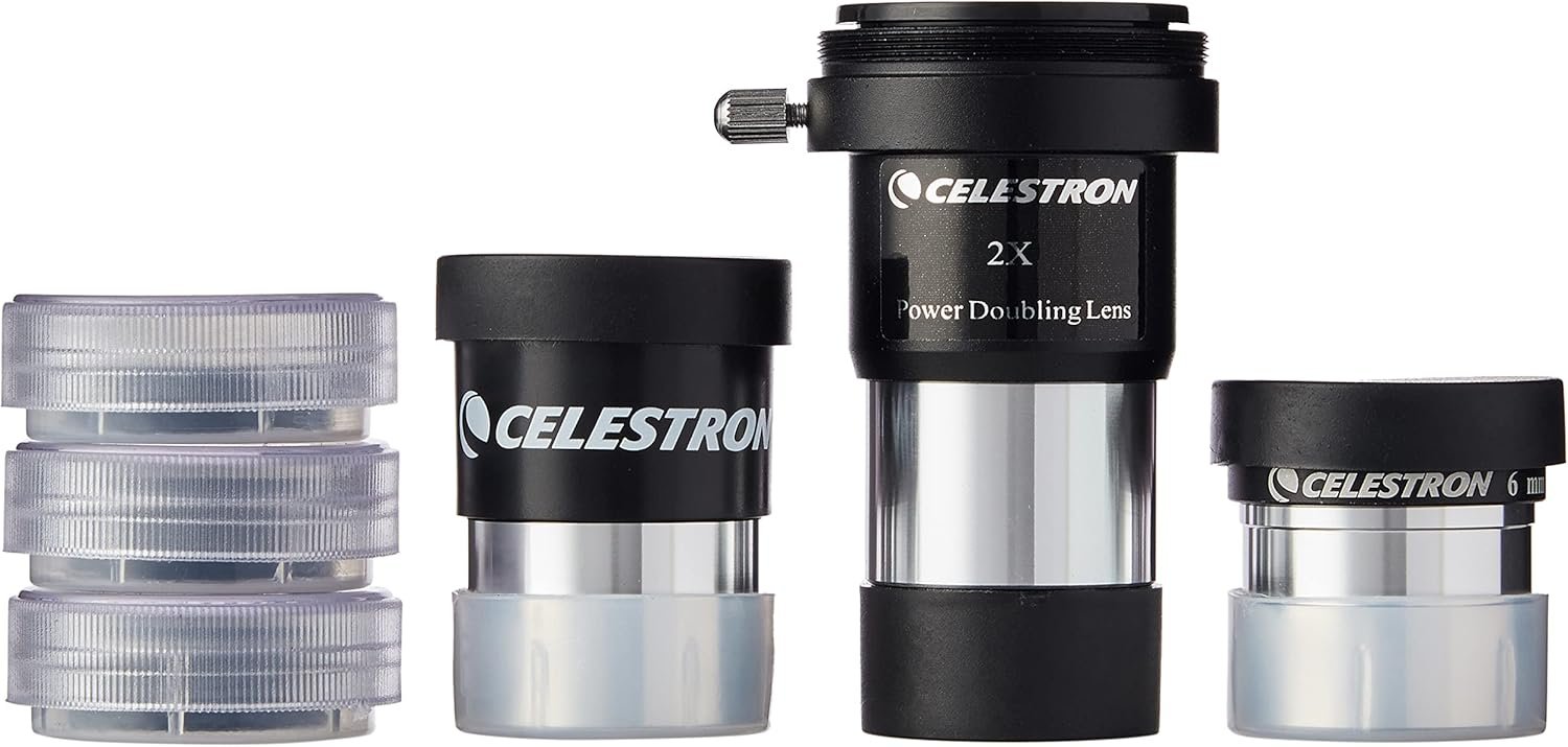 Celestron telescope accessory kit including four silver lens caps, two eyepieces, a 2x Power Doubling Lens, and a clear storage container.