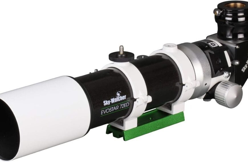 Black and white telescope labeled "Sky-Watcher Evostar 72ED," featuring a green mounting plate and a focus adjustment knob.