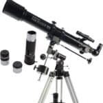 A black Celestron PowerSeeker 70EQ telescope mounted on a tripod, with two eyepieces and a 3x Barlow lens displayed beside it.
