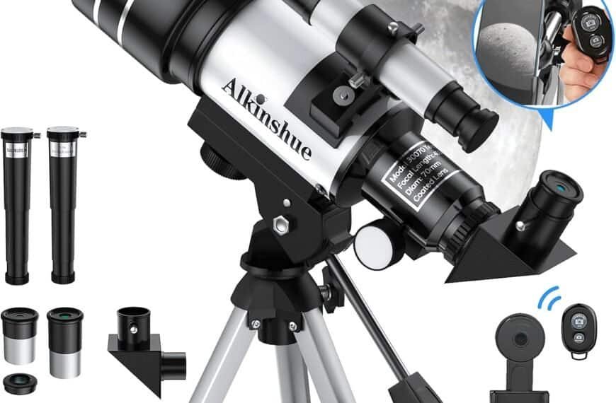 A silver Alkinshue telescope on a tripod with eyepieces, phone adapter, remote, and accessories, shown with a view of the moon in the background.