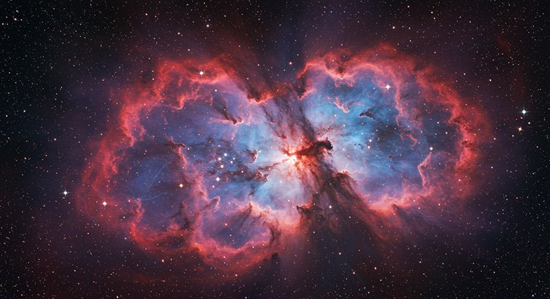 What is the Interstellar Medium (ISM)? 5 A colorful nebula in outer space, showing bright blue and red clouds of gas and dust surrounded by stars.