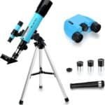 A blue telescope on a tripod with a finderscope, a pair of blue binoculars, three eyepieces, and an additional optical accessory displayed on a white background.