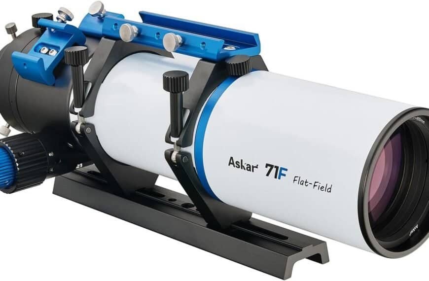A white and blue Askar 71F flat-field refractor telescope mounted on a black rail with adjustment knobs and a large focus dial.