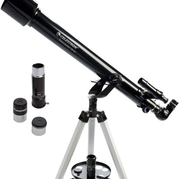 A black Celestron refractor telescope on a white tripod, with three interchangeable eyepieces placed nearby.