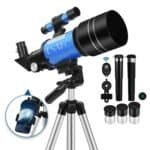 A blue and black ESako telescope on a tripod, shown with eyepieces, a phone holder, remote, and other accessories against a white background.