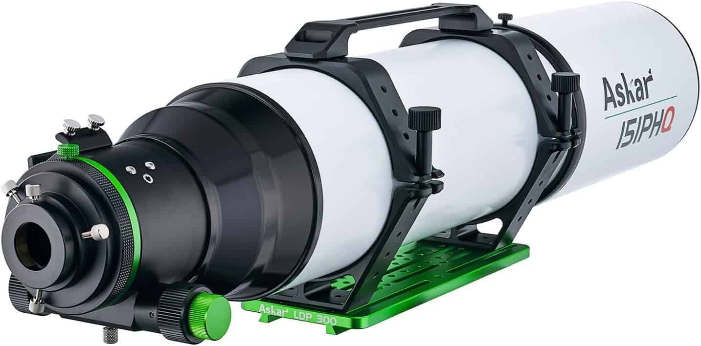 A white and black Askar 151PHQ refractor telescope mounted on a green base, featuring adjustment knobs and a carrying handle.
