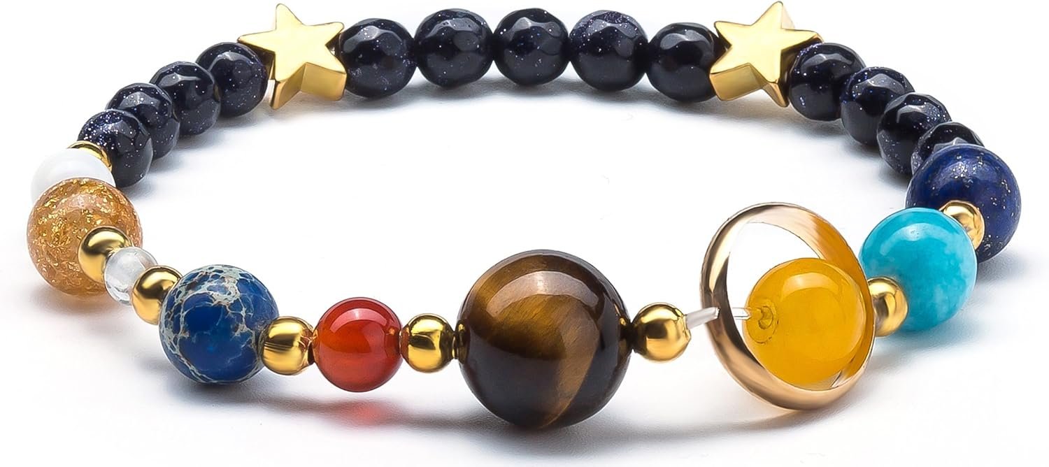 Beaded bracelet featuring stones of various colors and sizes, each representing a planet, with two gold star accents.