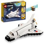 LEGO Creator 3-in-1 set with box, featuring a white space shuttle, a small satellite build, and package displaying 144 pieces for ages 6 and up.