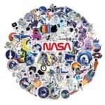 A circular collage of colorful NASA-themed stickers featuring astronauts, rockets, planets, and the NASA logo at the center.