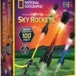 National Geographic Light-Up Sky Rockets STEM kit box showing three colorful rockets launching from a grassy field, with text stating rockets soar up to 100 feet and includes launch base.