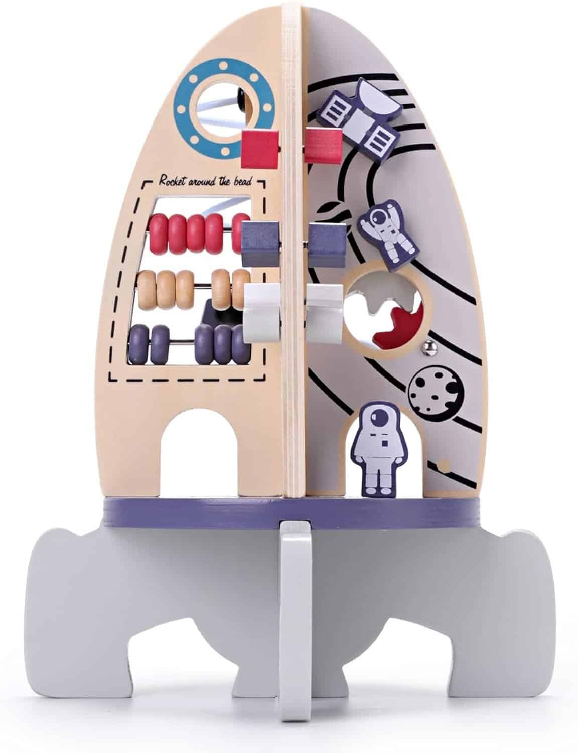 Wooden rocket-shaped activity toy featuring sliding beads, spinning blocks, and space-themed illustrations of astronauts and planets on a white background.