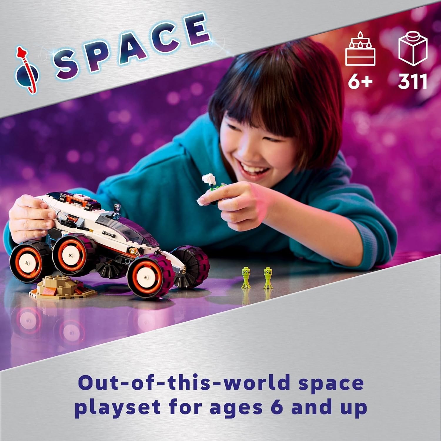 Child playing with a space-themed toy vehicle and small alien figures on a purple background; text indicates it’s a playset for ages 6+ with 311 pieces.